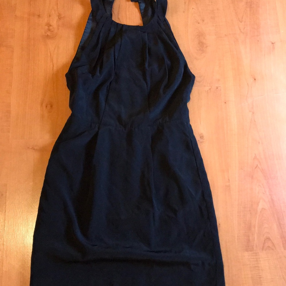 Cute black dress with open back and side pocket